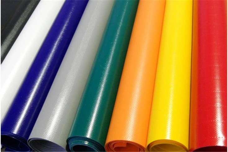 Multi-colored rolls of heavy-duty waterproof PVC tarpaulin material