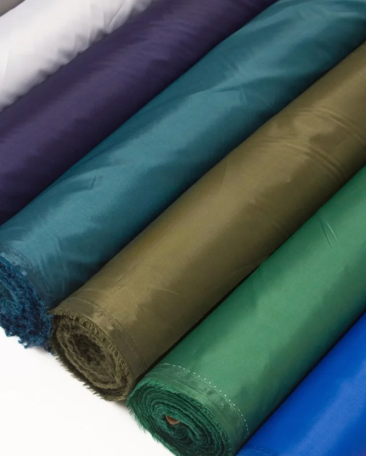 Assorted colorful rolls of lightweight waterproof parachute fabric and nylon ripstop material